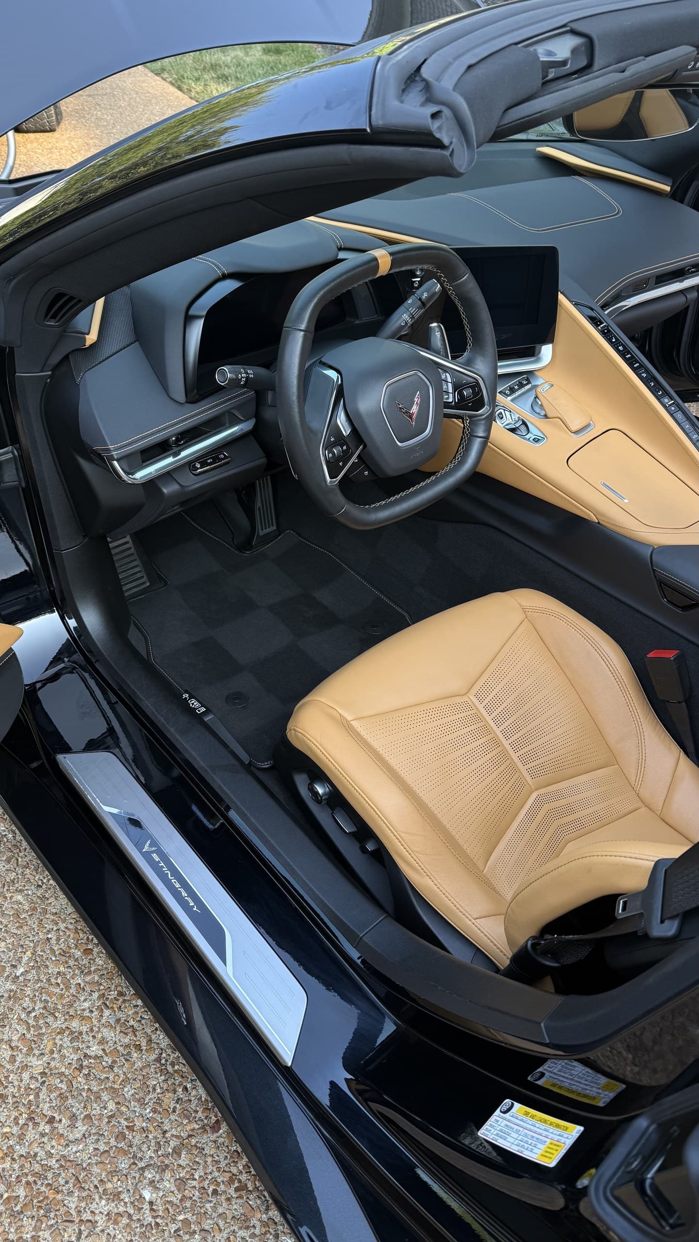 A tan leather convertible interior cleaned with the roof down