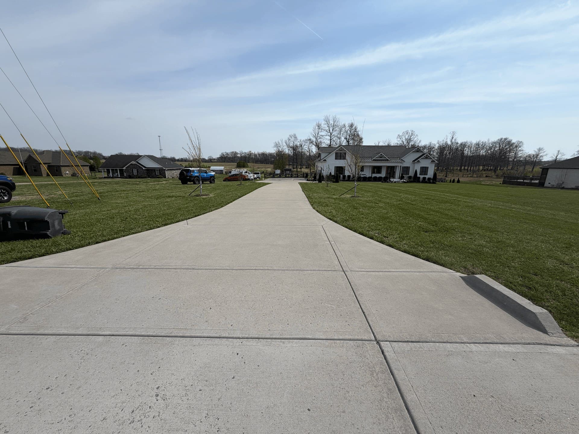 A long concrete driveway washed clean end to end